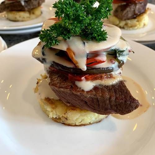 Feather-blade steak with chargrilled vegetables, whiskey cream sauce, shallot puree and a crushed potato cake