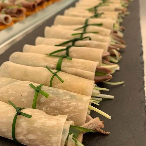 Mini duck pancakes with plum sauce, cucumber, spring onion and ginger